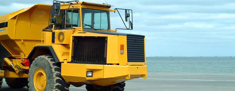 Yellow mining truck driving